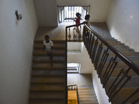 Migrant workers arrive at the Saint Joseph Jesuites Fathers Church, which is turned into a shelter to house families fleeing their homes as...