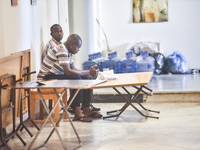 Migrant workers arrive at the Saint Joseph Jesuites Fathers Church, which is turned into a shelter to house families fleeing their homes as...