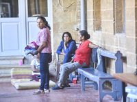 Migrant workers arrive at the Saint Joseph Jesuites Fathers Church, which is turned into a shelter to house families fleeing their homes as...