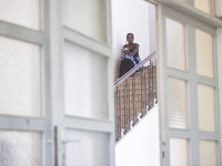 Migrant workers arrive at the Saint Joseph Jesuites Fathers Church, which is turned into a shelter to house families fleeing their homes as...