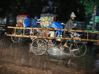 Residents of the city suffer from continuous rain in Dhaka, Bangladesh, on October 4, 2024. (