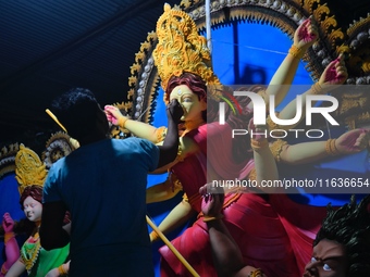 An artist works on an idol of Goddess Durga at a workshop ahead of Durga Puja in Dhaka, Bangladesh, on October 4, 2024. (