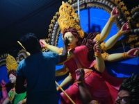 An artist works on an idol of Goddess Durga at a workshop ahead of Durga Puja in Dhaka, Bangladesh, on October 4, 2024. (