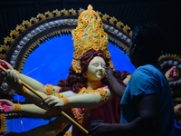 An artist works on an idol of Goddess Durga at a workshop ahead of Durga Puja in Dhaka, Bangladesh, on October 4, 2024. (