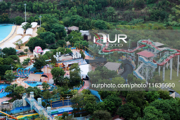 An aerial photo shows the Happy Valley scenic spot in Chongqing, China, on October 3, 2024. Chongqing Happy Valley opens on July 8, 2017, an...