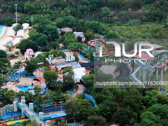 An aerial photo shows the Happy Valley scenic spot in Chongqing, China, on October 3, 2024. Chongqing Happy Valley opens on July 8, 2017, an...