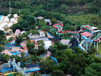 An aerial photo shows the Happy Valley scenic spot in Chongqing, China, on October 3, 2024. Chongqing Happy Valley opens on July 8, 2017, an...