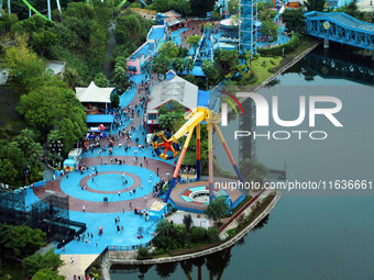 An aerial photo shows the Happy Valley scenic spot in Chongqing, China, on October 3, 2024. Chongqing Happy Valley opens on July 8, 2017, an...