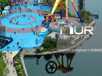 An aerial photo shows the Happy Valley scenic spot in Chongqing, China, on October 3, 2024. Chongqing Happy Valley opens on July 8, 2017, an...