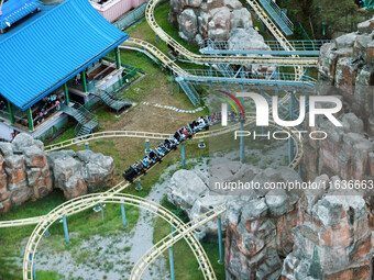 An aerial photo shows the Happy Valley scenic spot in Chongqing, China, on October 3, 2024. Chongqing Happy Valley opens on July 8, 2017, an...