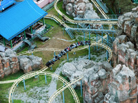 An aerial photo shows the Happy Valley scenic spot in Chongqing, China, on October 3, 2024. Chongqing Happy Valley opens on July 8, 2017, an...