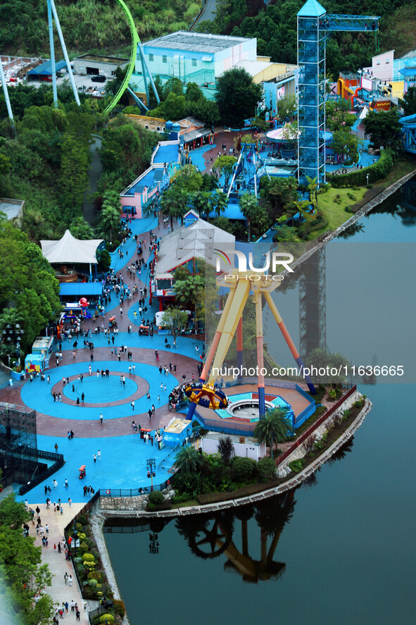 An aerial photo shows the Happy Valley scenic spot in Chongqing, China, on October 3, 2024. Chongqing Happy Valley opens on July 8, 2017, an...