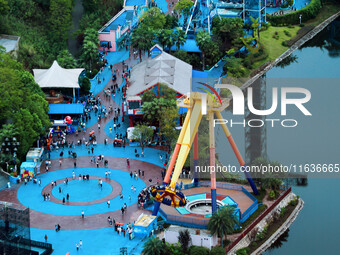 An aerial photo shows the Happy Valley scenic spot in Chongqing, China, on October 3, 2024. Chongqing Happy Valley opens on July 8, 2017, an...