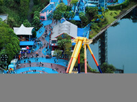 An aerial photo shows the Happy Valley scenic spot in Chongqing, China, on October 3, 2024. Chongqing Happy Valley opens on July 8, 2017, an...