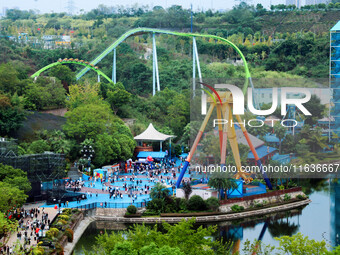 An aerial photo shows the Happy Valley scenic spot in Chongqing, China, on October 3, 2024. Chongqing Happy Valley opens on July 8, 2017, an...