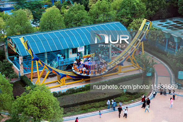 An aerial photo shows the Happy Valley scenic spot in Chongqing, China, on October 3, 2024. Chongqing Happy Valley opens on July 8, 2017, an...