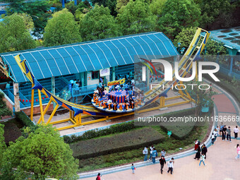 An aerial photo shows the Happy Valley scenic spot in Chongqing, China, on October 3, 2024. Chongqing Happy Valley opens on July 8, 2017, an...