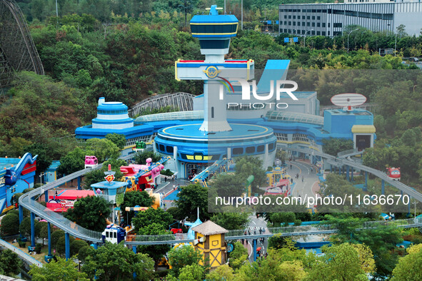 An aerial photo shows the Happy Valley scenic spot in Chongqing, China, on October 3, 2024. Chongqing Happy Valley opens on July 8, 2017, an...