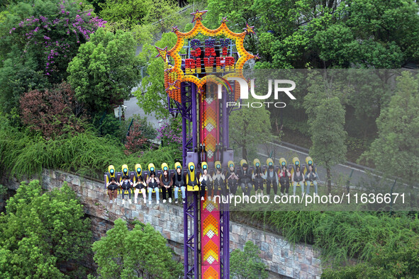 An aerial photo shows the Happy Valley scenic spot in Chongqing, China, on October 3, 2024. Chongqing Happy Valley opens on July 8, 2017, an...