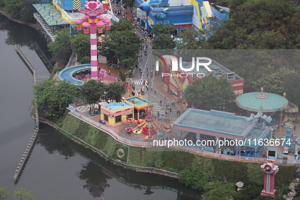 An aerial photo shows the Happy Valley scenic spot in Chongqing, China, on October 3, 2024. Chongqing Happy Valley opens on July 8, 2017, an...