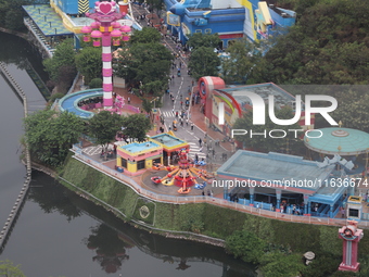 An aerial photo shows the Happy Valley scenic spot in Chongqing, China, on October 3, 2024. Chongqing Happy Valley opens on July 8, 2017, an...