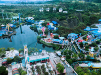 An aerial photo shows the Happy Valley scenic spot in Chongqing, China, on October 3, 2024. Chongqing Happy Valley opens on July 8, 2017, an...