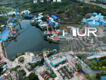 An aerial photo shows the Happy Valley scenic spot in Chongqing, China, on October 3, 2024. Chongqing Happy Valley opens on July 8, 2017, an...