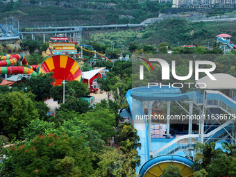 An aerial photo shows the Happy Valley scenic spot in Chongqing, China, on October 3, 2024. Chongqing Happy Valley opens on July 8, 2017, an...