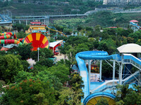 An aerial photo shows the Happy Valley scenic spot in Chongqing, China, on October 3, 2024. Chongqing Happy Valley opens on July 8, 2017, an...