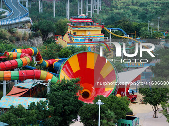 An aerial photo shows the Happy Valley scenic spot in Chongqing, China, on October 3, 2024. Chongqing Happy Valley opens on July 8, 2017, an...