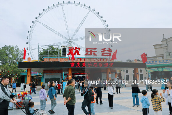 Tourists play at Happy Valley scenic spot in Chongqing, China, on October 4, 2024. Chongqing Happy Valley opens on July 8, 2017, and is the...