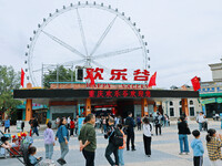 Tourists play at Happy Valley scenic spot in Chongqing, China, on October 4, 2024. Chongqing Happy Valley opens on July 8, 2017, and is the...