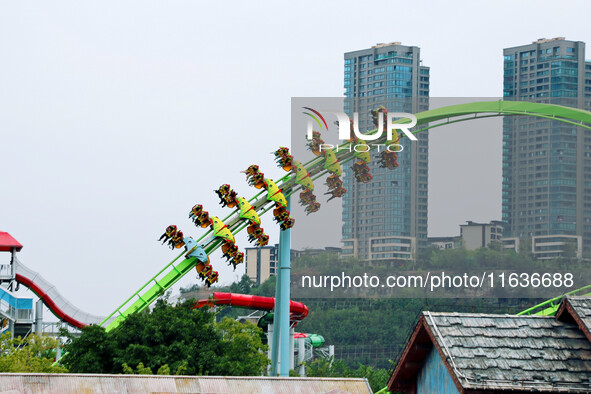 Tourists play at Happy Valley scenic spot in Chongqing, China, on October 4, 2024. Chongqing Happy Valley opens on July 8, 2017, and is the...