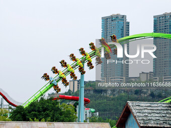 Tourists play at Happy Valley scenic spot in Chongqing, China, on October 4, 2024. Chongqing Happy Valley opens on July 8, 2017, and is the...