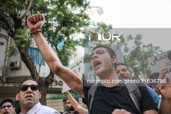 A young man shouts slogans against President Kais Saied and raises his fist during a demonstration organized by the Tunisian Network for Rig...