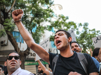 A young man shouts slogans against President Kais Saied and raises his fist during a demonstration organized by the Tunisian Network for Rig...