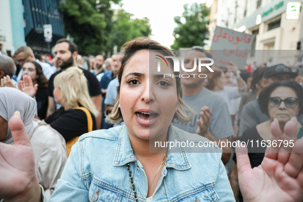 A woman shouts against President Kais Saied during a demonstration organized by the Tunisian Network for Rights and Freedoms in Tunis, Tunis...