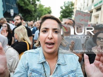 A woman shouts against President Kais Saied during a demonstration organized by the Tunisian Network for Rights and Freedoms in Tunis, Tunis...