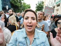 A woman shouts against President Kais Saied during a demonstration organized by the Tunisian Network for Rights and Freedoms in Tunis, Tunis...