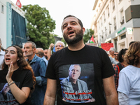 Elyes Chaouachi, son of political prisoner Ghazi Chaouachi, wears a T-shirt bearing a photo of his father and attends a demonstration organi...