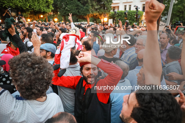 A demonstrator raises a puppet and shouts slogans against President Kais Saied during a demonstration organized by the Tunisian Network for...