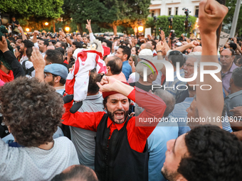 A demonstrator raises a puppet and shouts slogans against President Kais Saied during a demonstration organized by the Tunisian Network for...