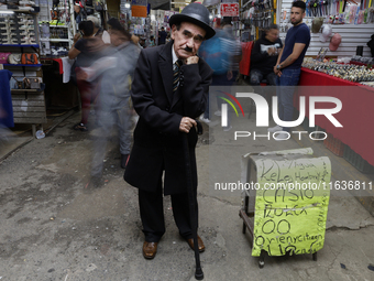 A Charles Chaplin impersonator performs in Tepito, Mexico City, on October 4, 2024, where the inhabitants celebrate the Day of St. Francis o...