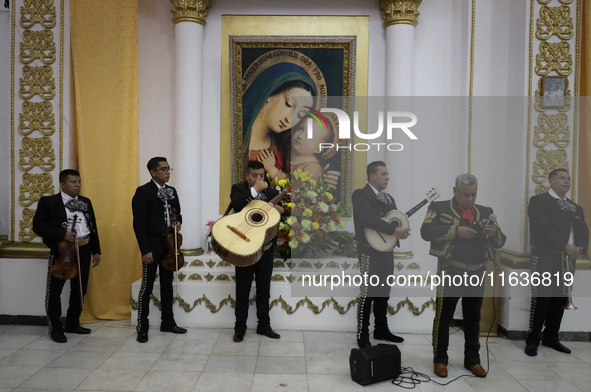 Mariachis perform during a first communion in a church in Tepito, Mexico City, on October 4, 2024, where the inhabitants celebrate the Day o...