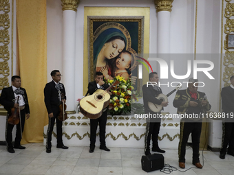 Mariachis perform during a first communion in a church in Tepito, Mexico City, on October 4, 2024, where the inhabitants celebrate the Day o...