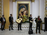 Mariachis perform during a first communion in a church in Tepito, Mexico City, on October 4, 2024, where the inhabitants celebrate the Day o...