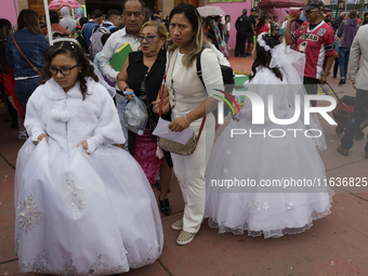 A view shows girls participating in a first communion at a church in Tepito, Mexico City, on October 4, 2024, where the inhabitants celebrat...