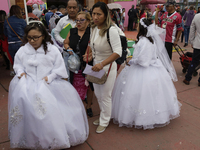 A view shows girls participating in a first communion at a church in Tepito, Mexico City, on October 4, 2024, where the inhabitants celebrat...