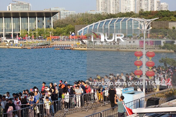 Tourists visit the International Sailing Center in Qingdao, China, on October 3, 2024. 