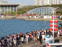 Tourists visit the International Sailing Center in Qingdao, China, on October 3, 2024. (